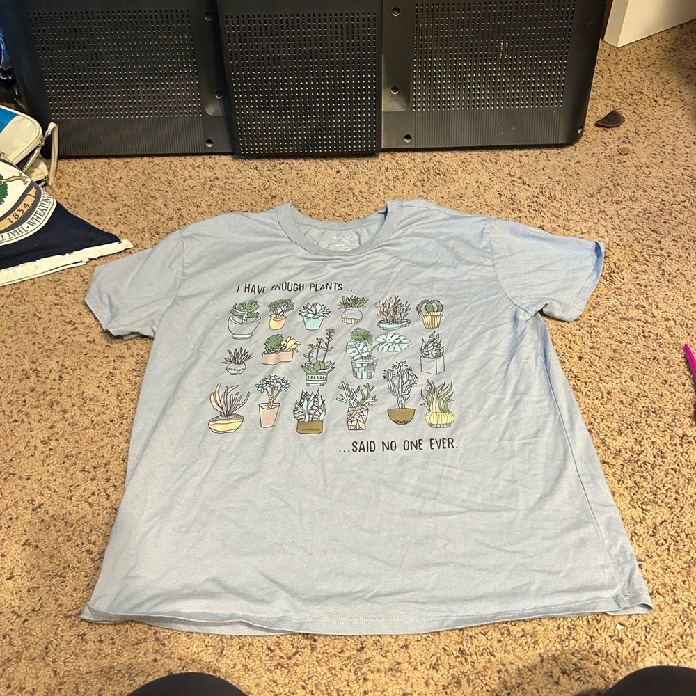 Light Blue Graphic T-Shirt with Plant Design